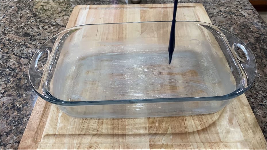 Applying butter to a baking dish