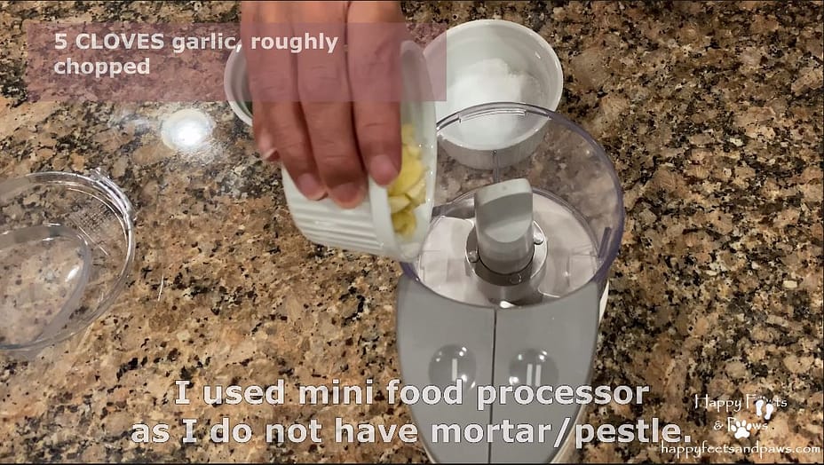 pouring ingredients into food processor for thai chicken fried rice recipe