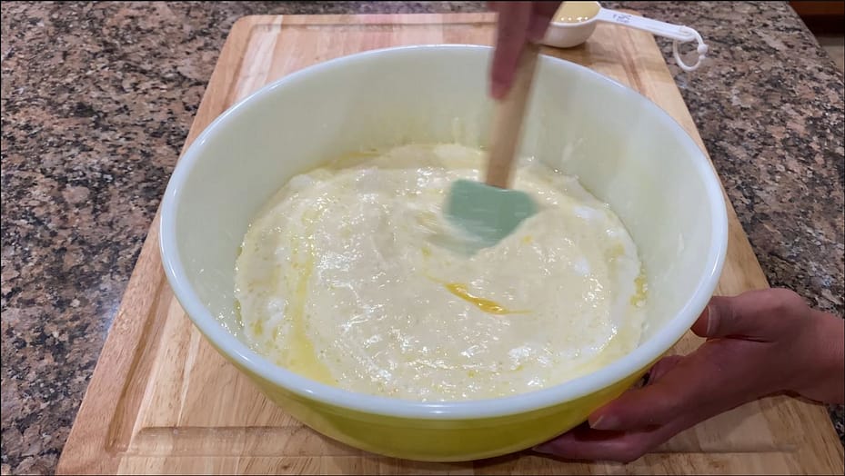 Mixing the cassava cake ingredients in a bowl