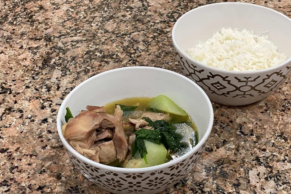 A bowl of Tinolang Manok with white rice on the side