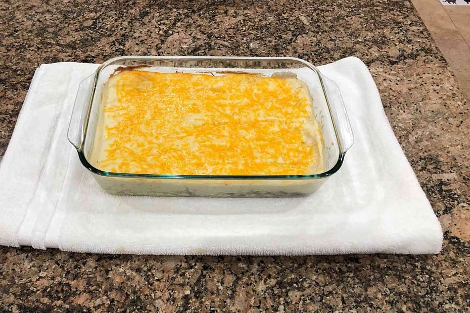 shepherds pie in a glassware with melted cheese on top