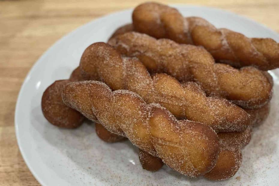 shakoy or Filipino donuts on a plate stacked
