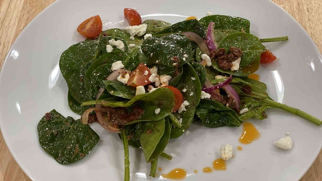 Spinach Salad with feta cheese on a plate