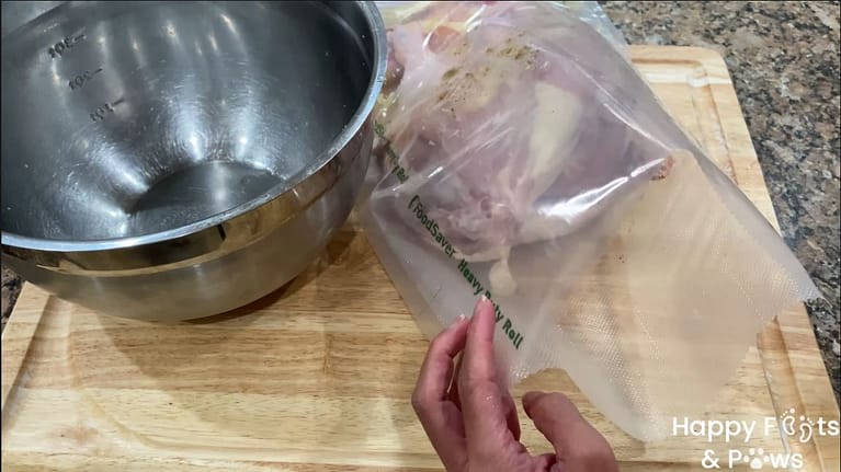 adding chicken to large plastic bag filled with chicken inasal marinade