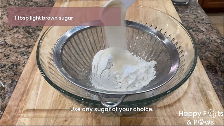 Adding dry ingredients to bowl for pancakes