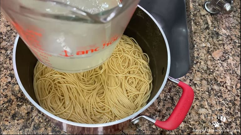 pasta water being saved from spaghetti noodles
