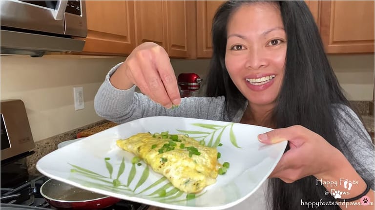 woman serving denver omelet
