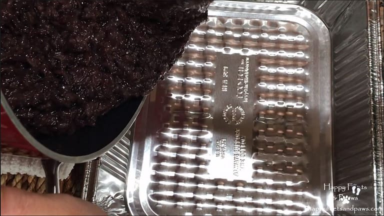 black rice being added to tin pan for biko recipe