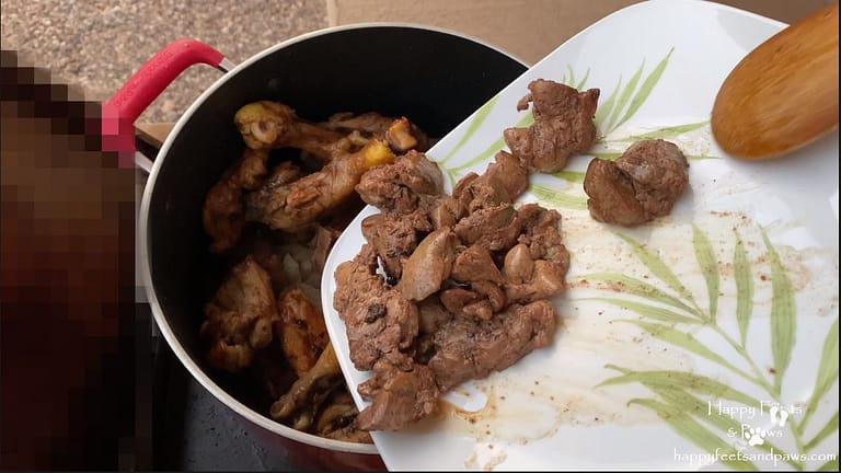 combining meat and ingredients for Filipino Adobo recipe.