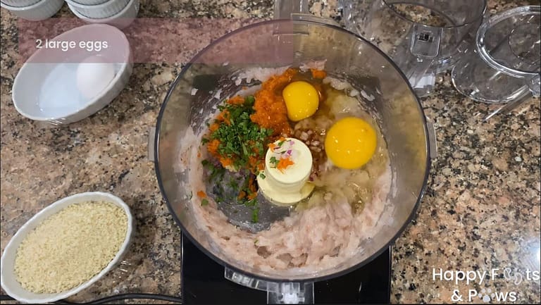 Eggs, carrots and ground shrimp in a food processor