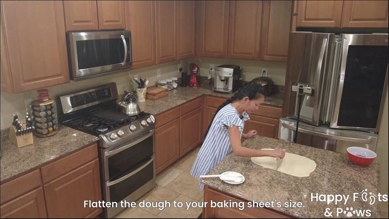 woman cutting dough prior to baking ube bars bread