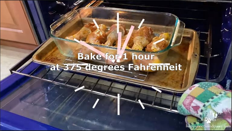 chicken drumsticks being placed in the oven