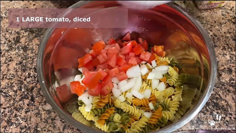 pasta salad being mixed