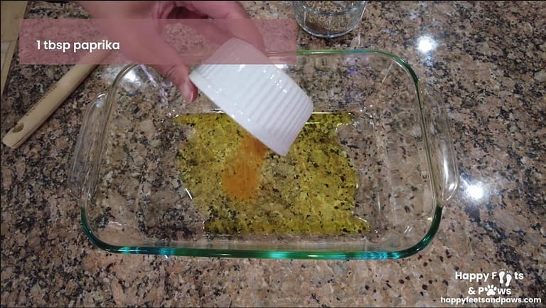 mixing oil and spices in glassware for baked asparagus recipe