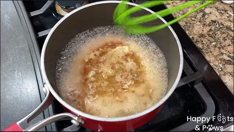 Beurre Blanc Sauce cooking down in a pot on a stove