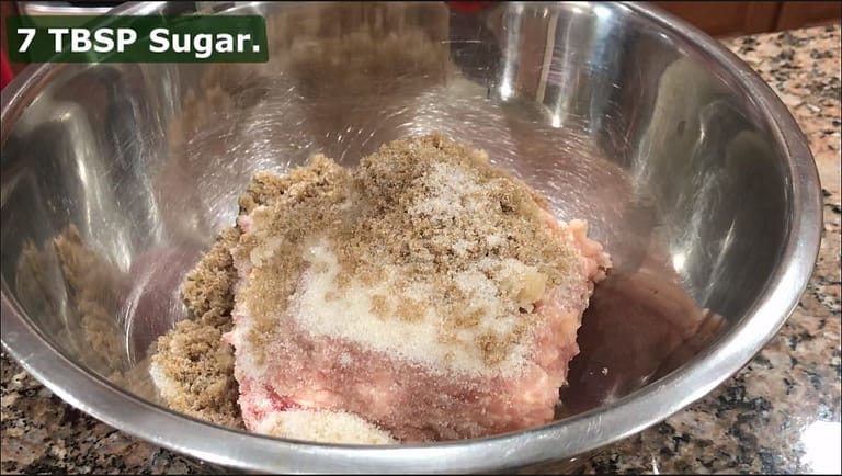 ground pork and chicken in a bowl with sugar for skinless longanisa recipe