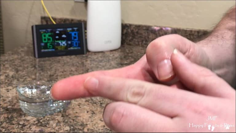 showing with finger how to measure for cooking rice