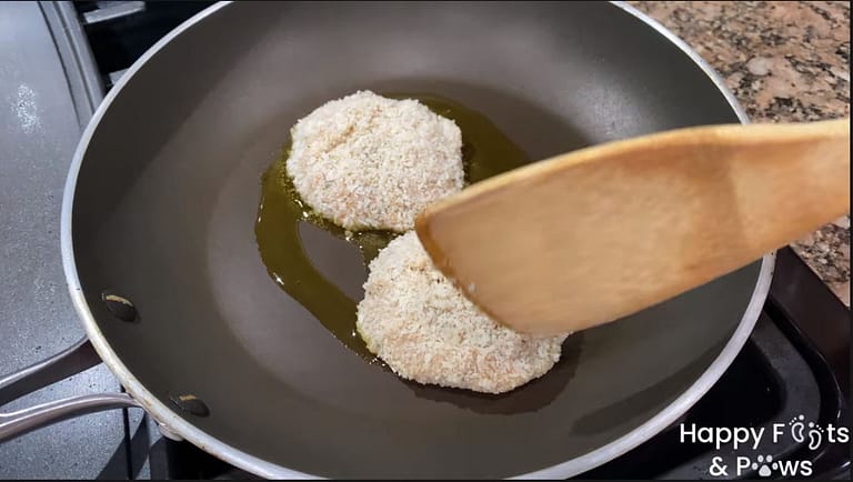 Shrimp Cakes frying on a pan with oil