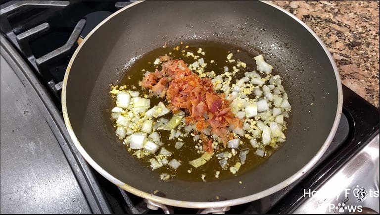 bacon, onions and garlic cooking in a pot
