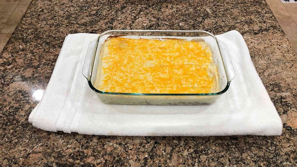 shepherds pie in a glassware with melted cheese on top