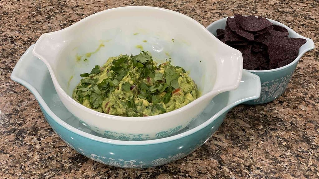 home made guacamole in a bowl with chips