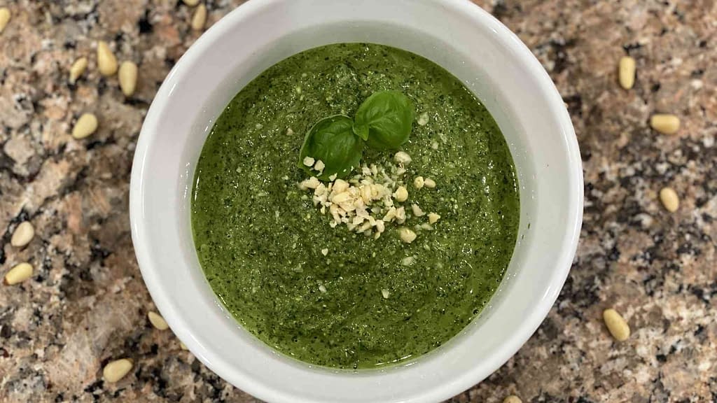 Fresh home made pesto in a small glass container