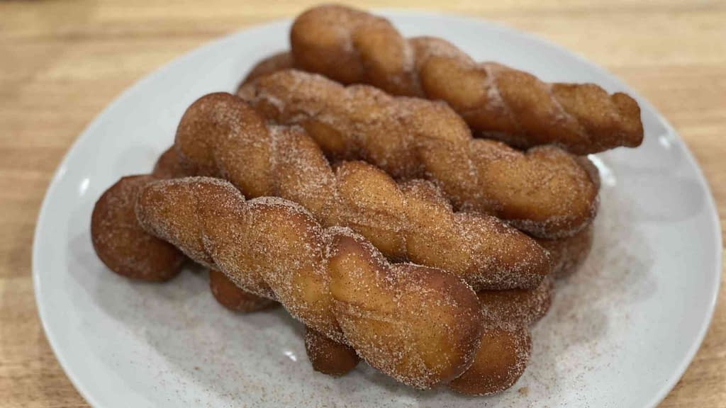 shakoy or Filipino donuts on a plate stacked