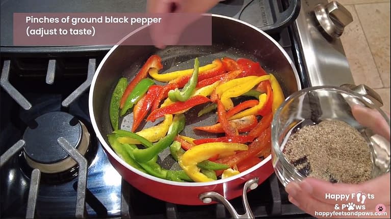 peppers being cooked in a pot on a stove for Pork Guisantes recipe