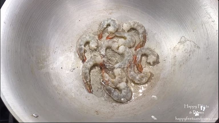 shrimp being cooked in wok