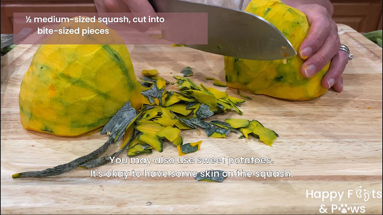 Cutting large squash with a knife on a wooden cutting board