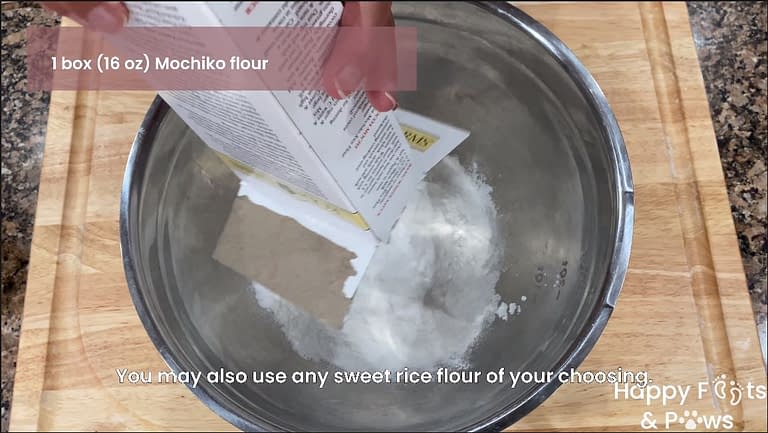 Mochiko flour being poured into a mixing bowl for butter mochi recipe