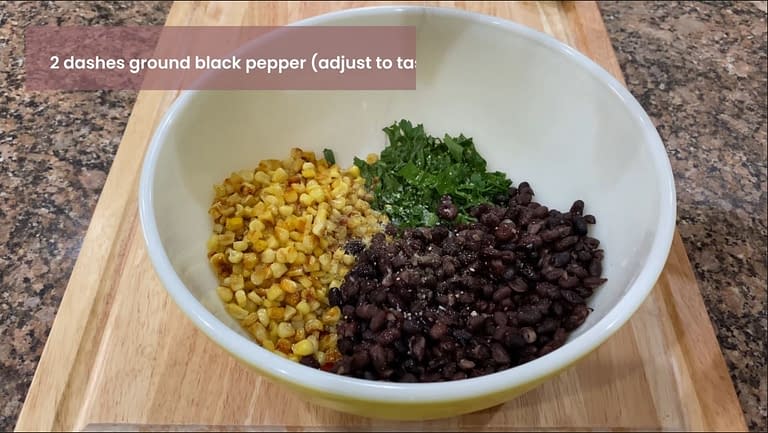 Adding ingredients to bowl for island roasted corn relish