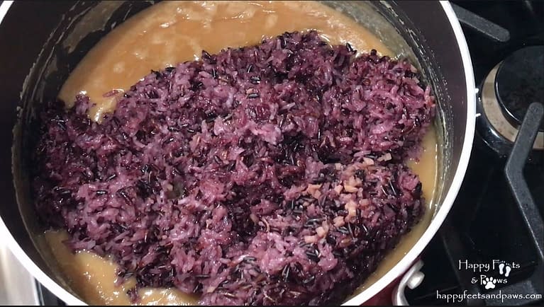 black rice being added to coconut milk for biko recipe