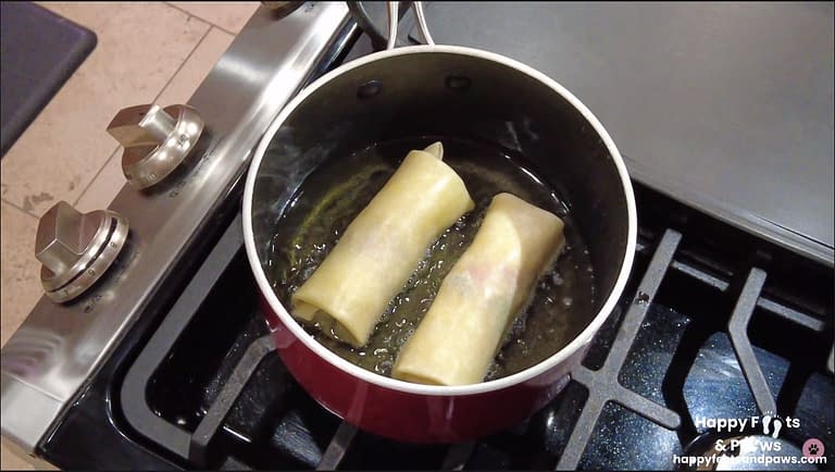south west egg rolls being cooked in oil on a stove