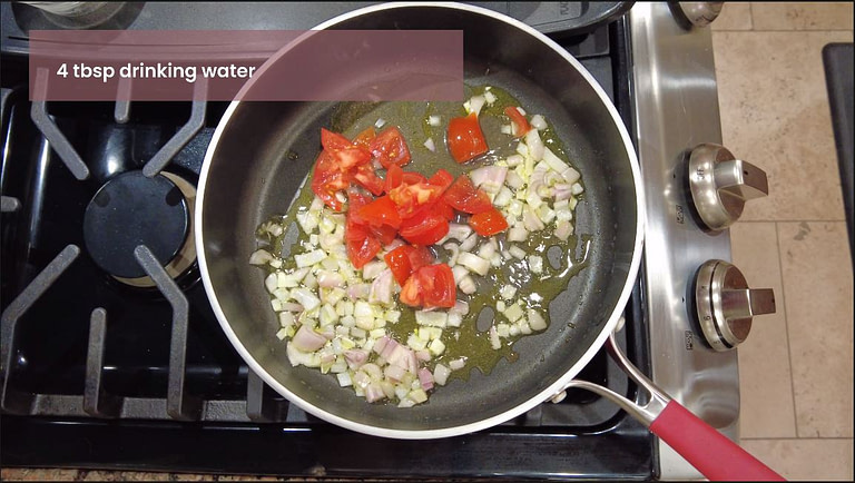 onions and tomatos being cooked in a pot on a stove for white bean ravioli recipe